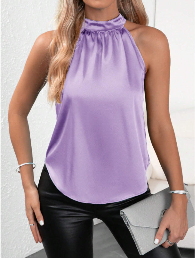 Elevan cualquier look al instante. Esta blusa de satén con cuello halter y caída fluida combina sofisticación y frescura en una sola prenda. Diseñada sin mangas y con una textura satinada suave de acabado brillante, es la pieza perfecta para pasar de una